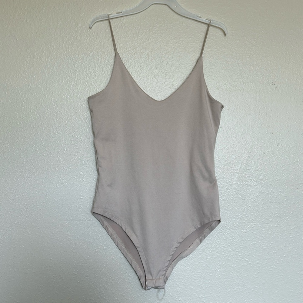 Nude tan bodysuit with snap buttons